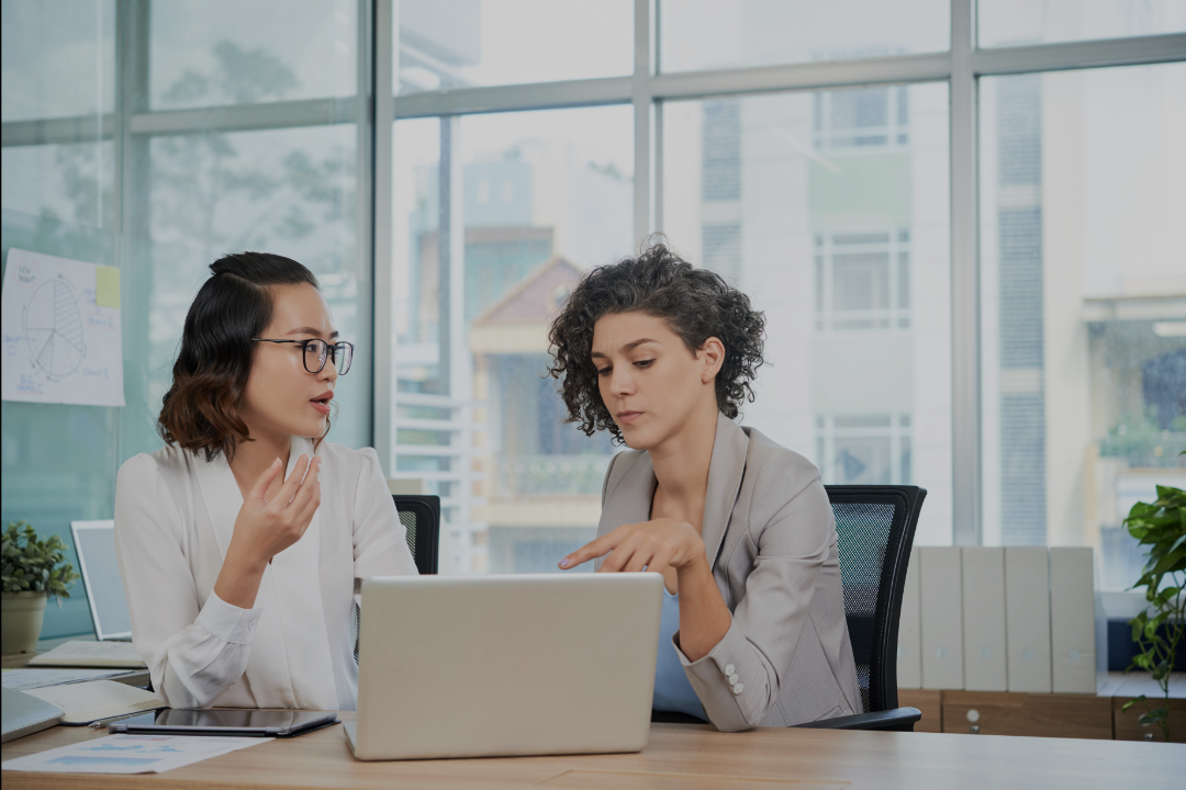 Two brand representatives collaborating on a joint content project, highlighting teamwork for off-page SEO success.