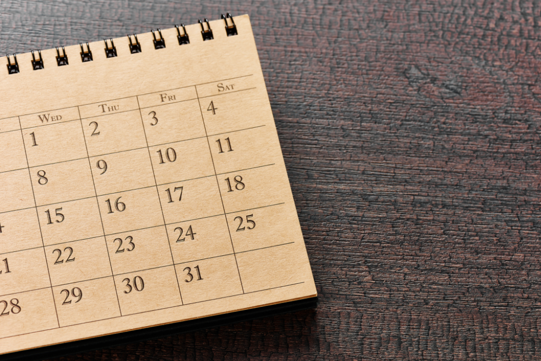 Infographic showing steps to build a content calendar with icons of a calendar, checklist, and megaphone.