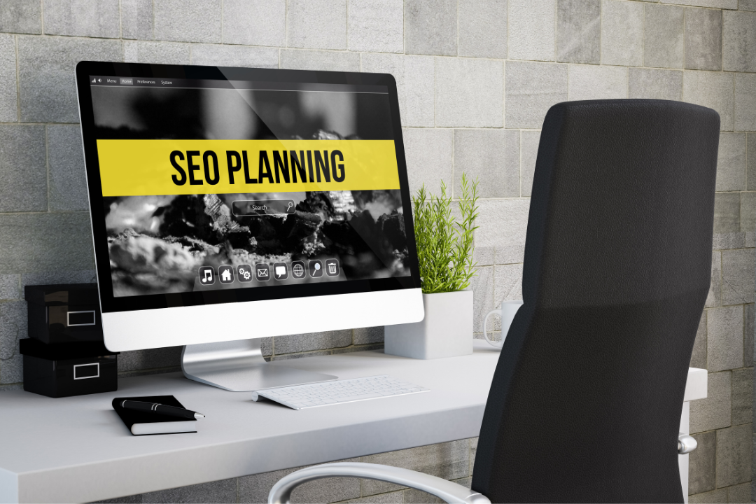 A content strategist at a dual-monitor desk balancing SEO data and engaging blog content in a creative workspace.