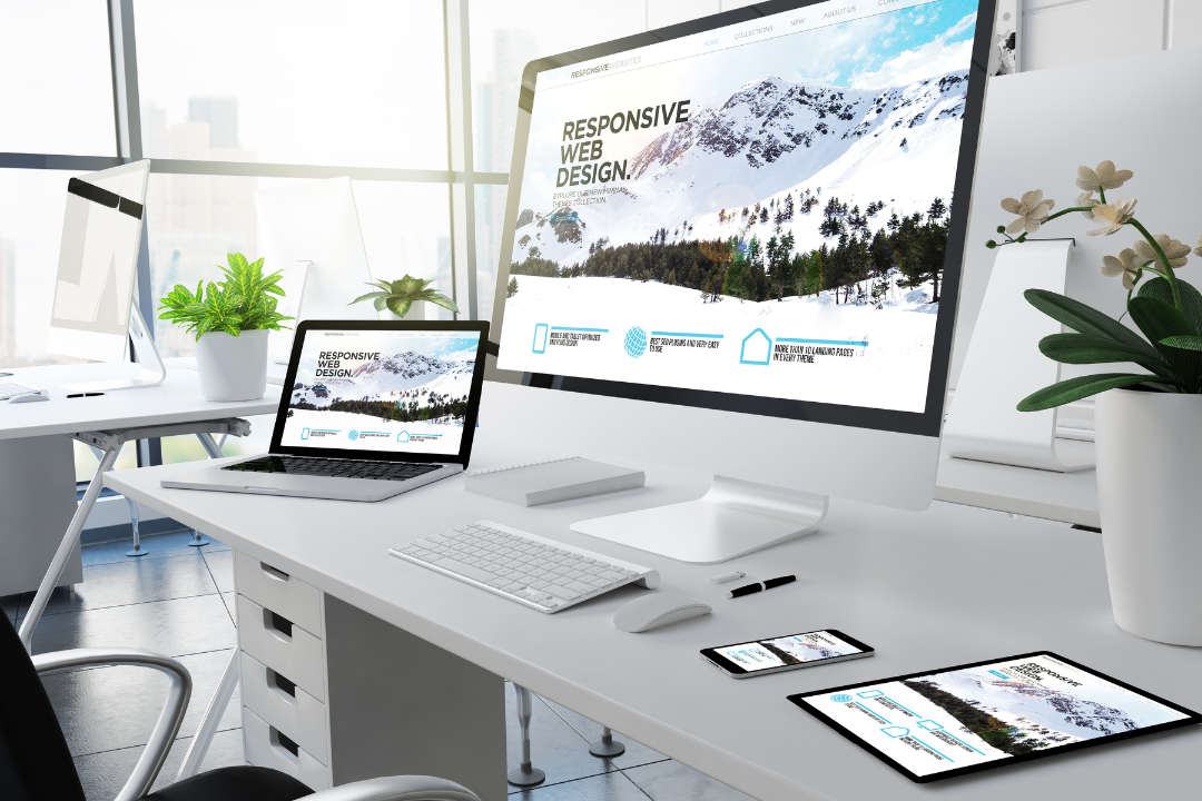 A modern flat-lay digital workspace showing a smartphone, tablet, and laptop screen displaying responsive website designs. The visuals highlight a website adjusting smoothly across different devices — symbolizing cross-platform optimization and mobile responsiveness.