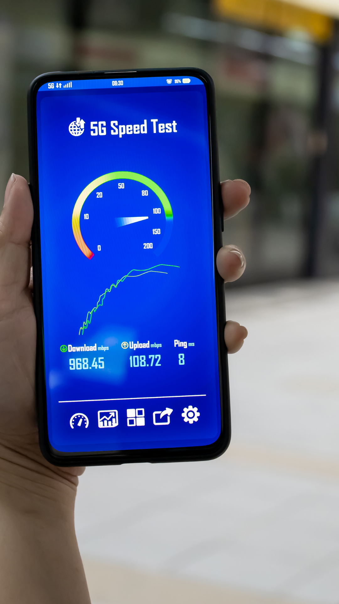 Smartphone with a speedometer graphic indicating optimized page speed for mobile SEO