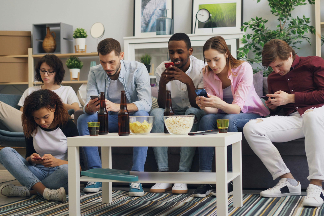 Happy customers sharing product recommendations with friends using mobile phones, illustrating referral marketing and word-of-mouth growth.