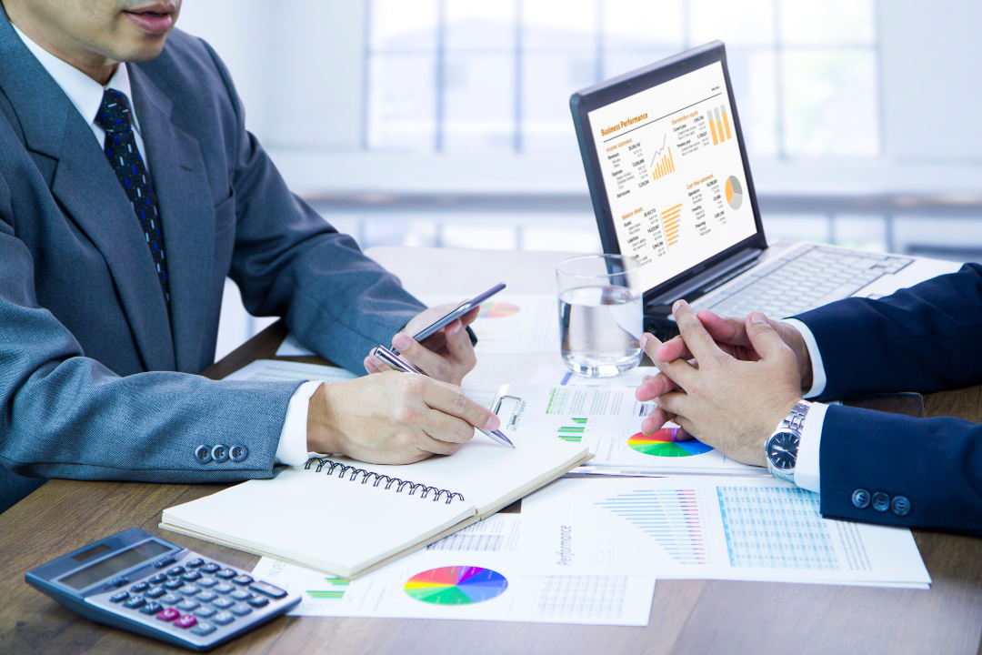 Frustrated business team reviewing SEO performance charts in a modern office.