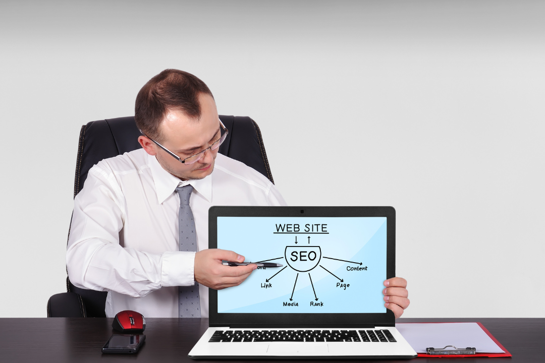 A square illustration showing icons for SEO and user engagement orbiting around a glowing laptop.