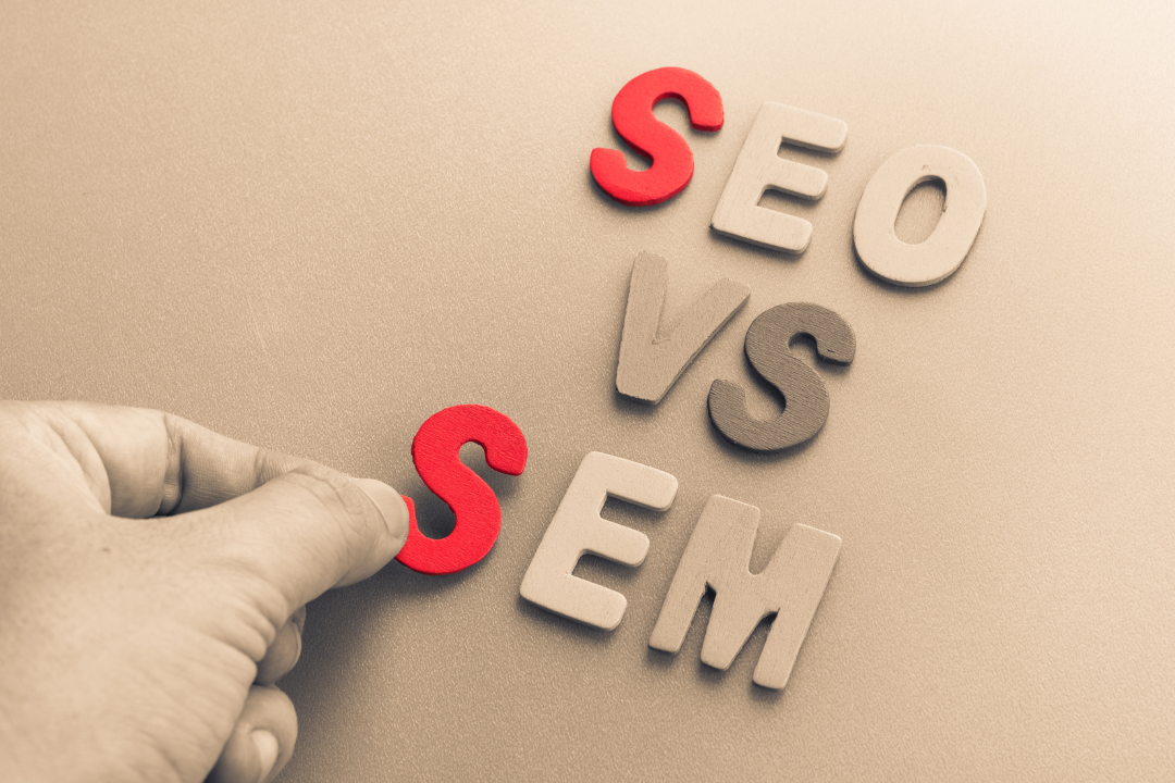 Side-by-side comparison of SEO and SEM represented by two colored halves, highlighting their distinct approaches in digital marketing.