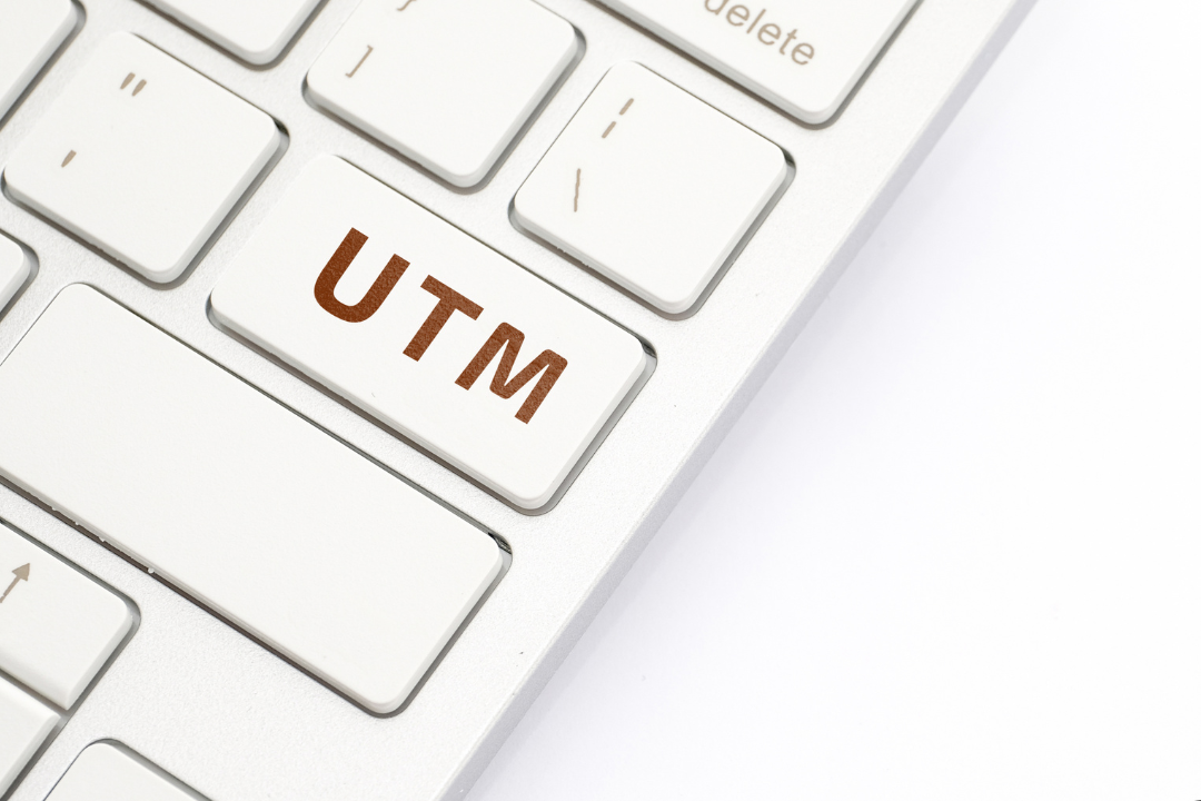 A close-up view of a marketer creating a UTM link on a computer with visible URL parameters and campaign tracking elements.