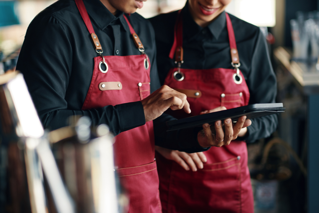 A digital illustration showing a restaurant waiter delivering food to a customer, symbolizing how APIs carry requests and responses between users and servers.